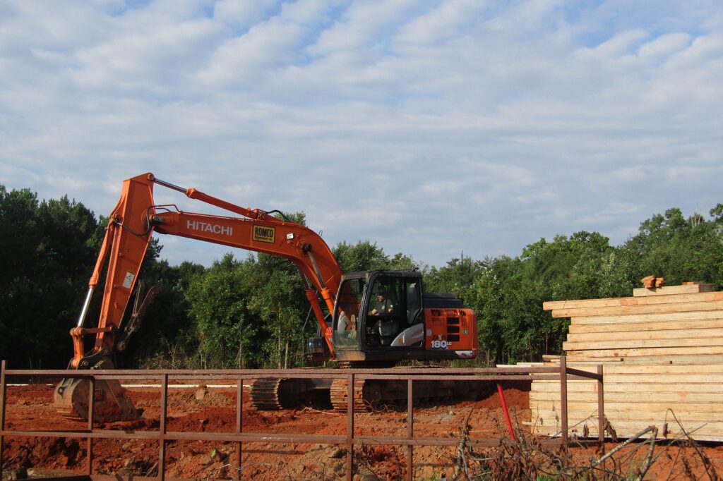 Fountain Electric & Services heavy equipment moving dirt at commercial electrical job site