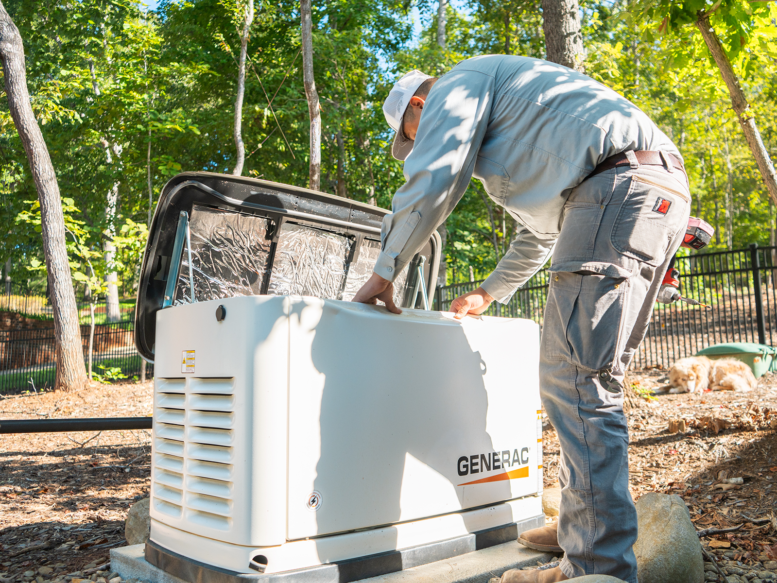 A Fountain Electric technician looking installing a Generac home standby generator.