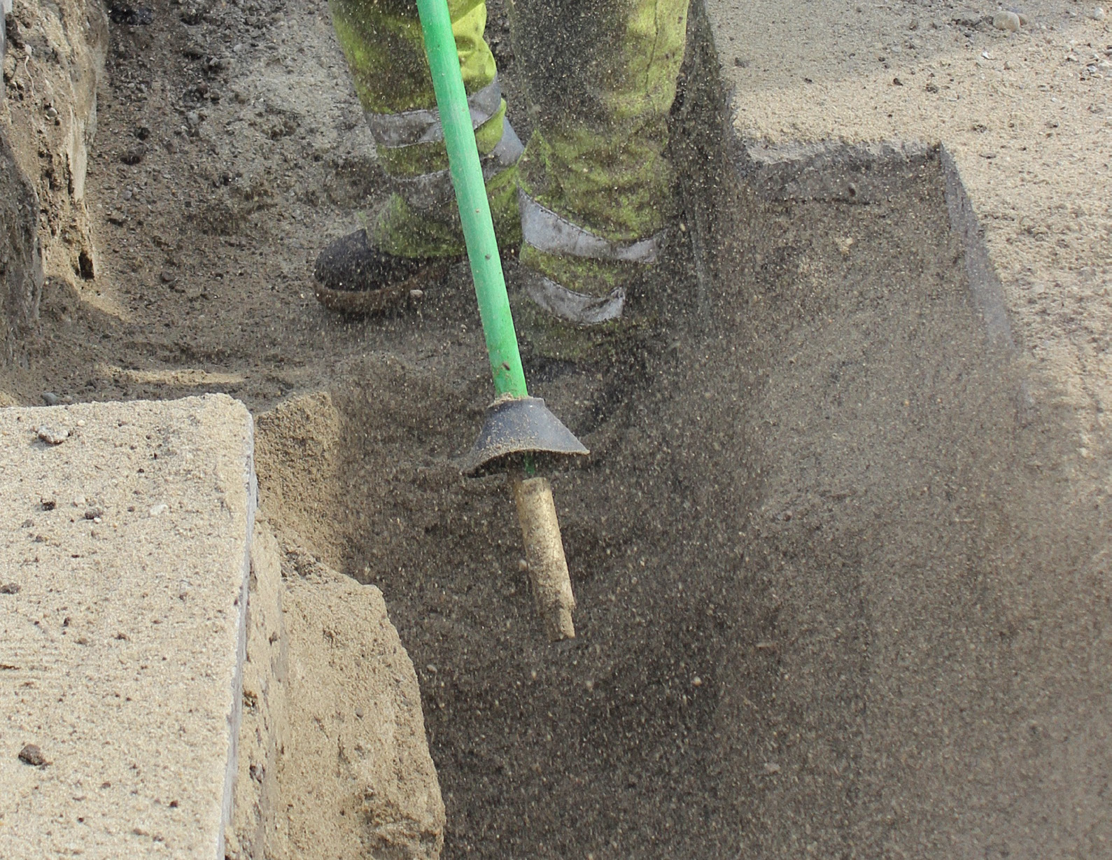 Air excavation uses a specialized tool to break up soil.