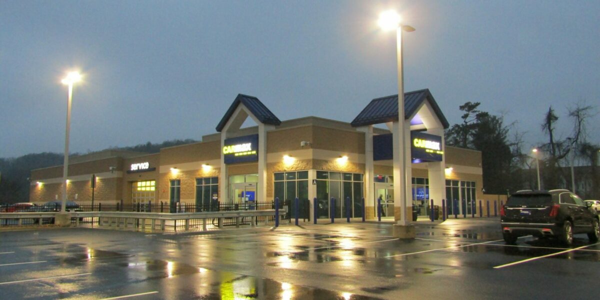 Outside of Carmax Asheville showing outdoor lighting work in parking lot.